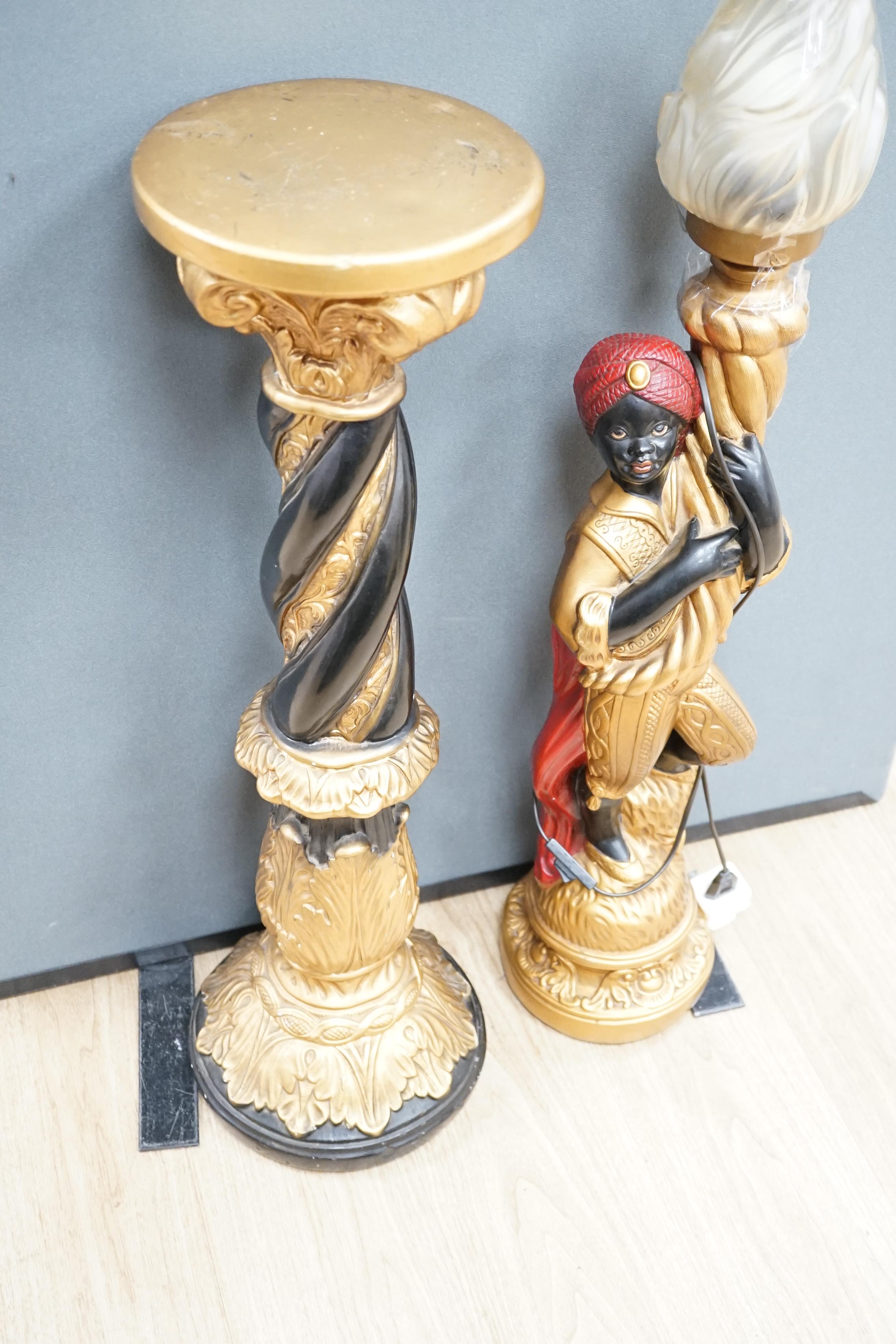 A moulded composition Blackamoor floor-lamp with glass torch shade, on stand, 158cm high